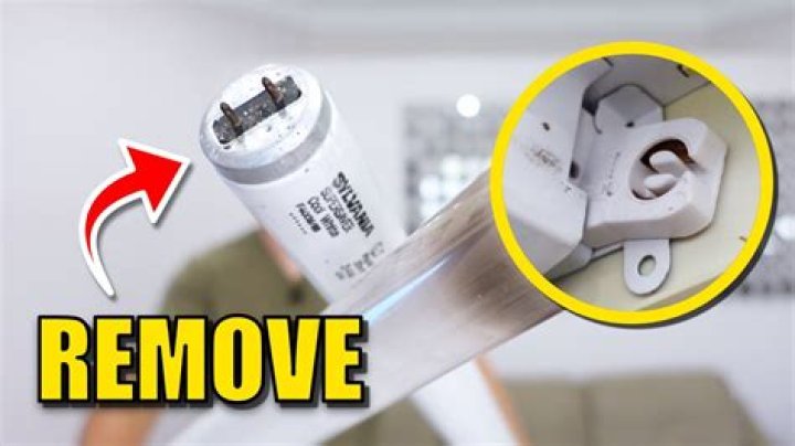 How do you remove the cover from a Remington typewriter?