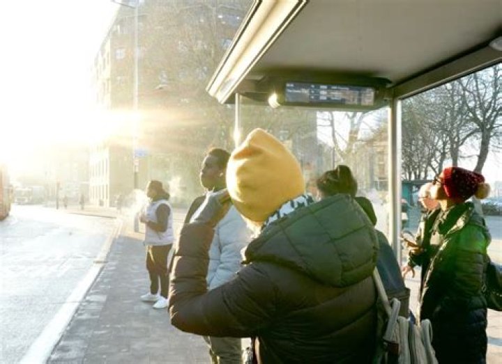 How do you stay warm while waiting for the bus?