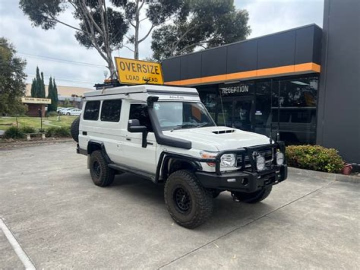 How wide can you be without a pilot car?