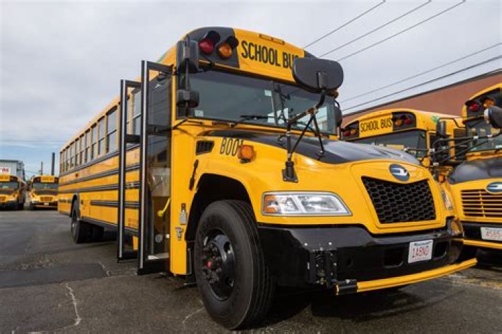 Where is the engine located in a school bus?