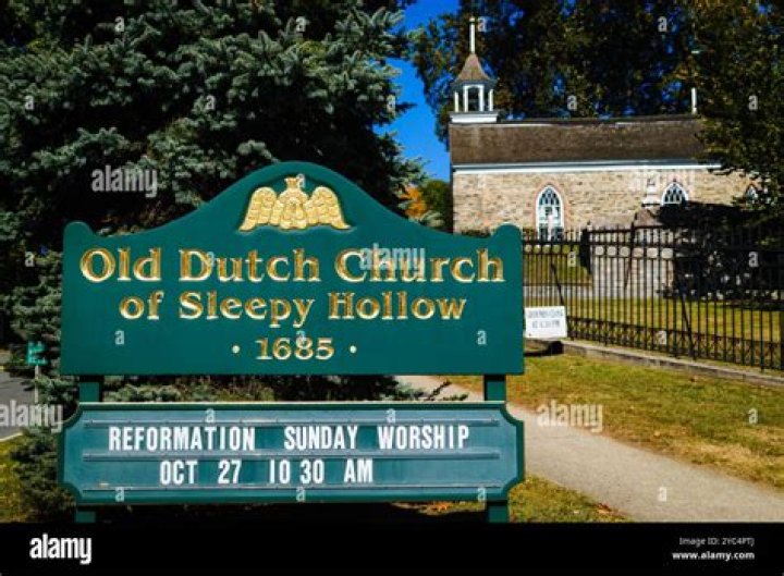 Who is buried in Old Dutch Church Sleepy Hollow?