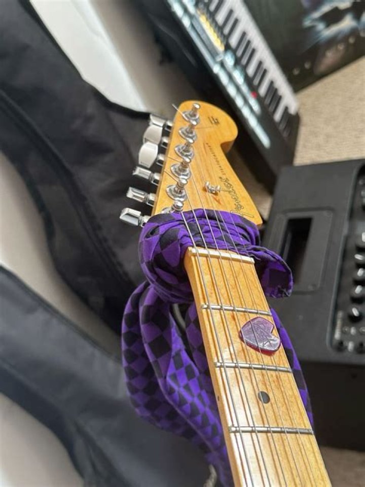 Why do people wrap cloth around guitar neck?